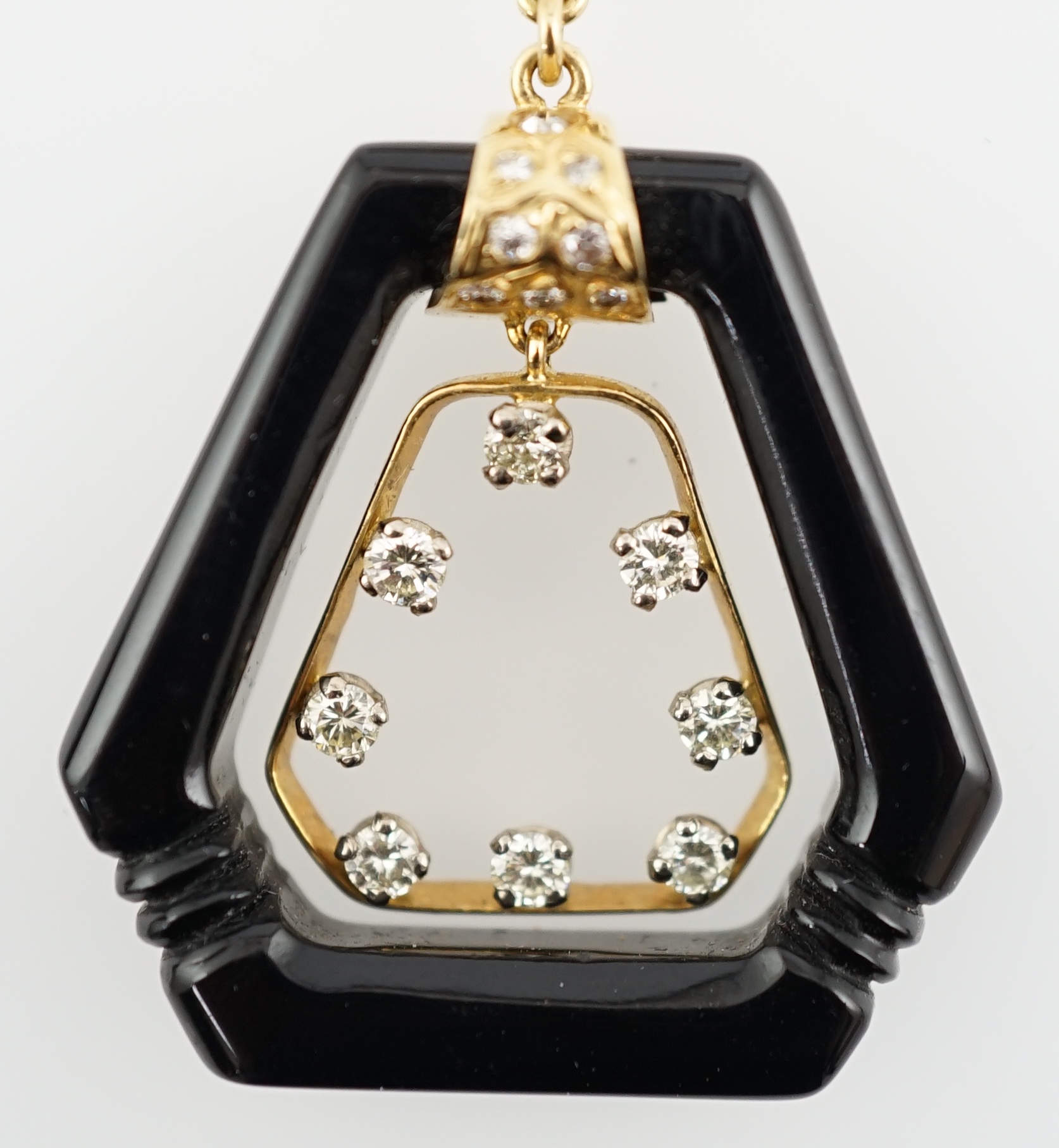 An Art Deco 18ct gold mounted black onyx and diamond set openwork drop pendant